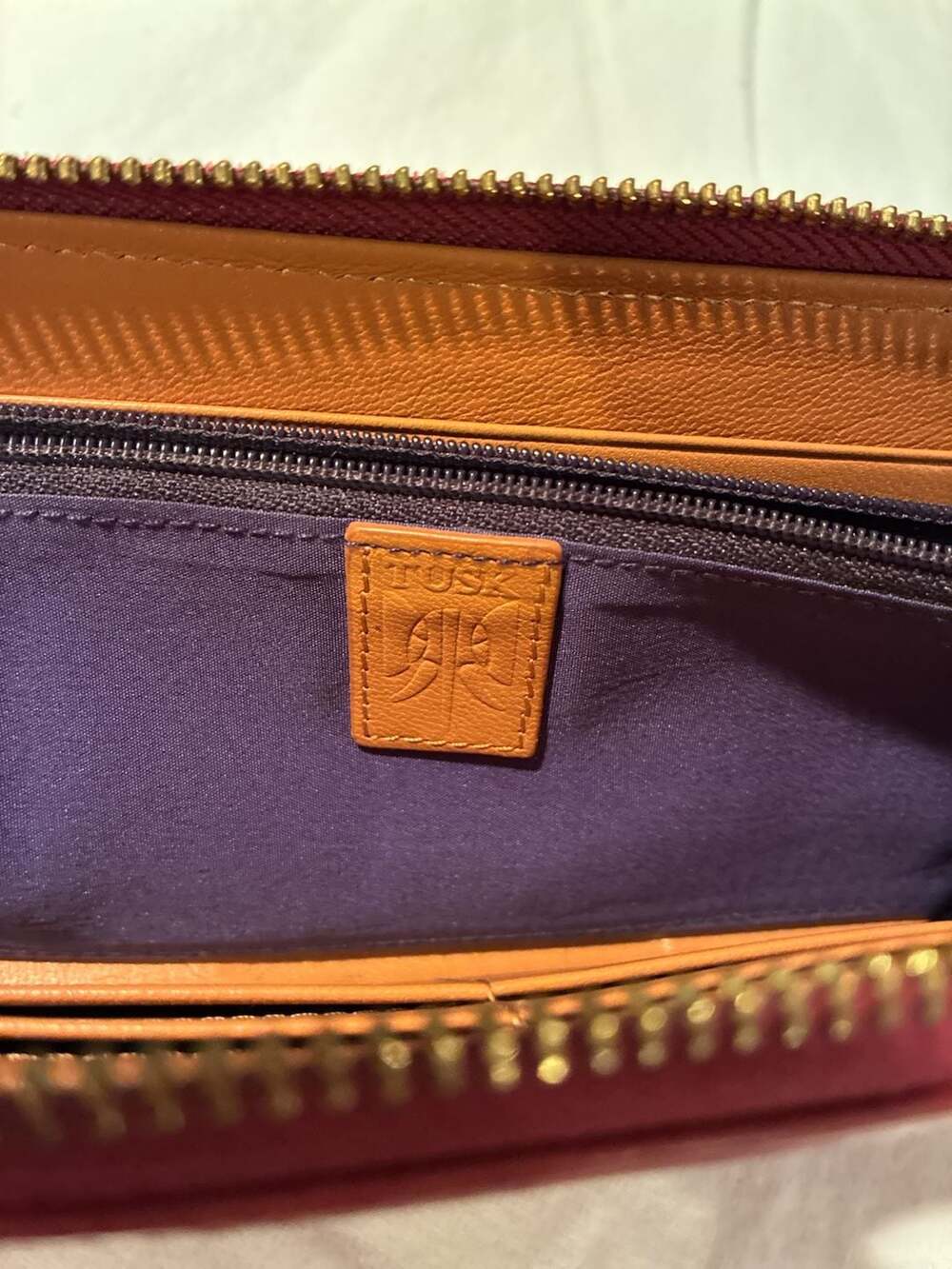 Tusk leather zip-around continental wallet in berry/fuchsia